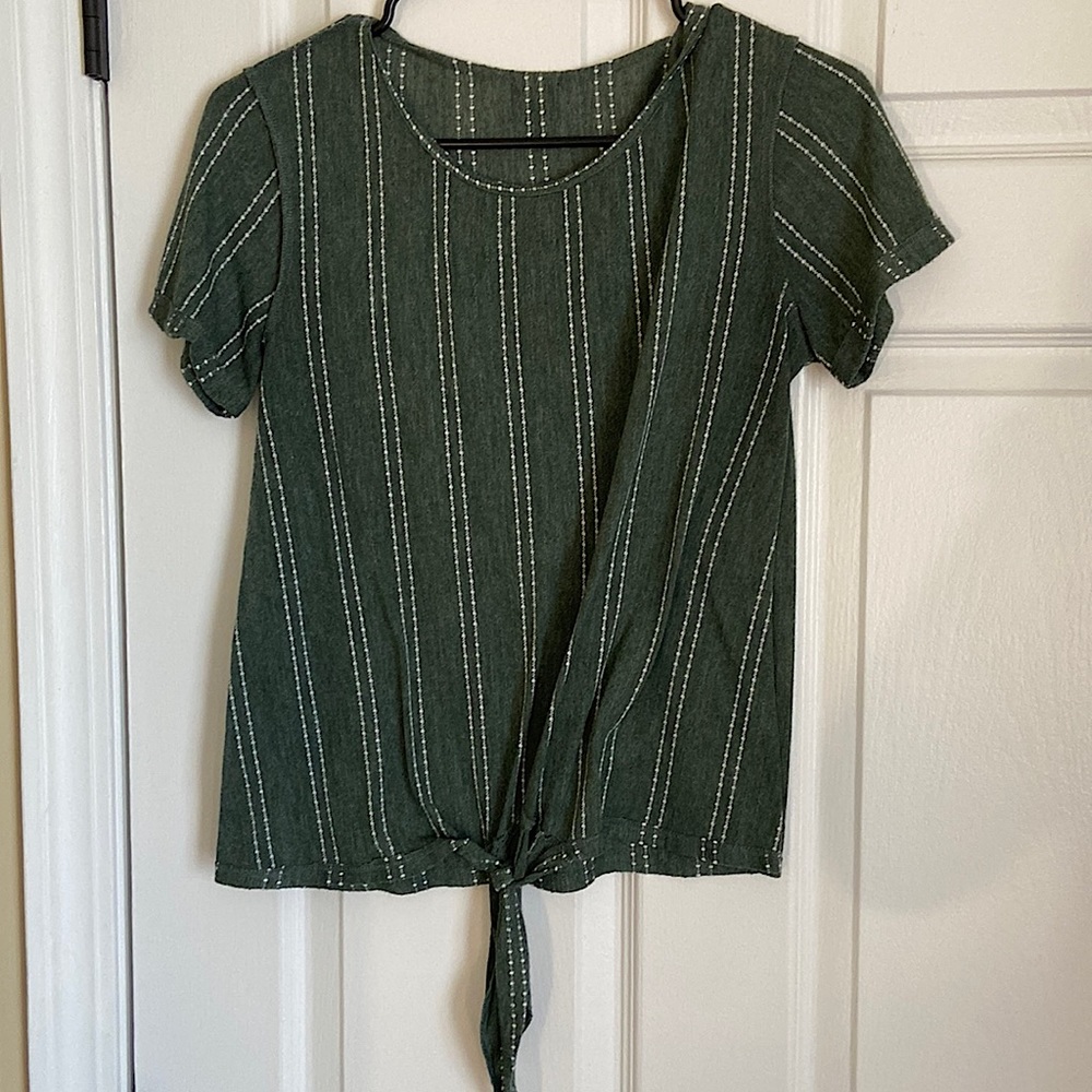 Lightweight green top with white stitching